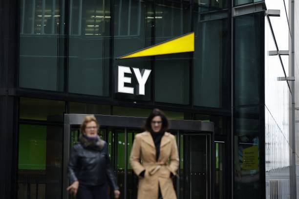 EY reduces pay raises and bonuses for UK tax staff following a slower year.
